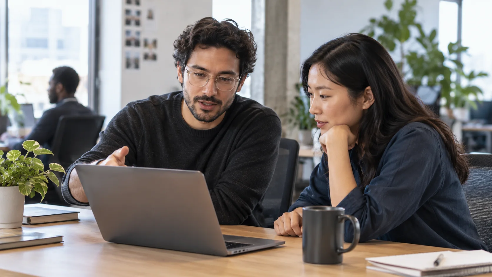 Two developers review a code change together.